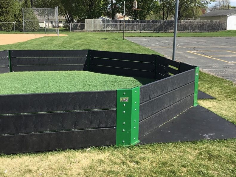 gaga pit with turf and plastic walls